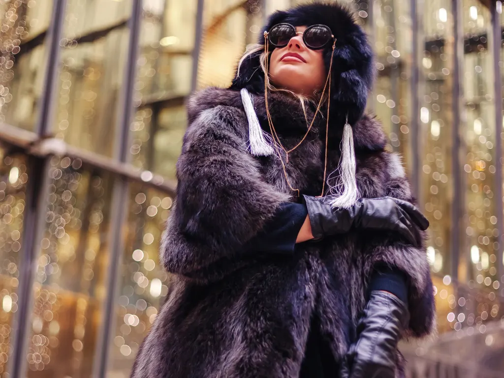 model posing with gloves and scarf